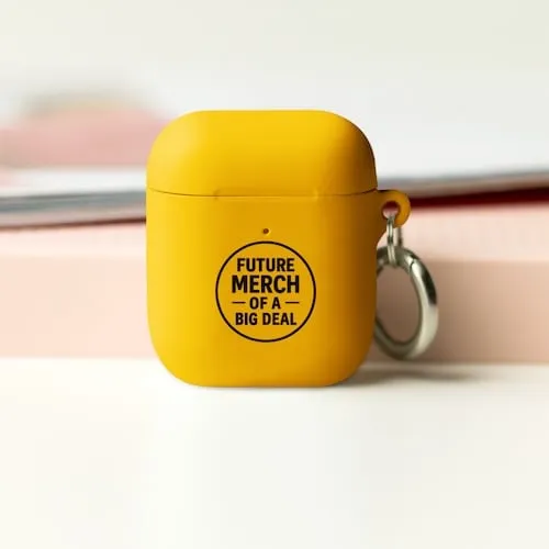 A yellow Airpods case with black text that says Future Merch of a Big Deal representing tech accessory promotional products available in our store for same-day online ordering in Houston .